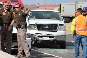 Utah Highway Patrol Sgt. Danny Ferguson had his second close call in the last year when a minivan crashed into a truck just feet from where he stood, St. George, Utah, July 31, 2015 | Photo by Nataly Burdick, St. George News