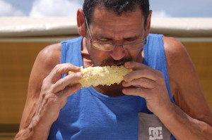 Gobbling up the corn during the corn eating contest at the Enterprise Cornfest, Enterprise, Utah, August 29, 2015 | Photo by Hollie Reina, St. George News