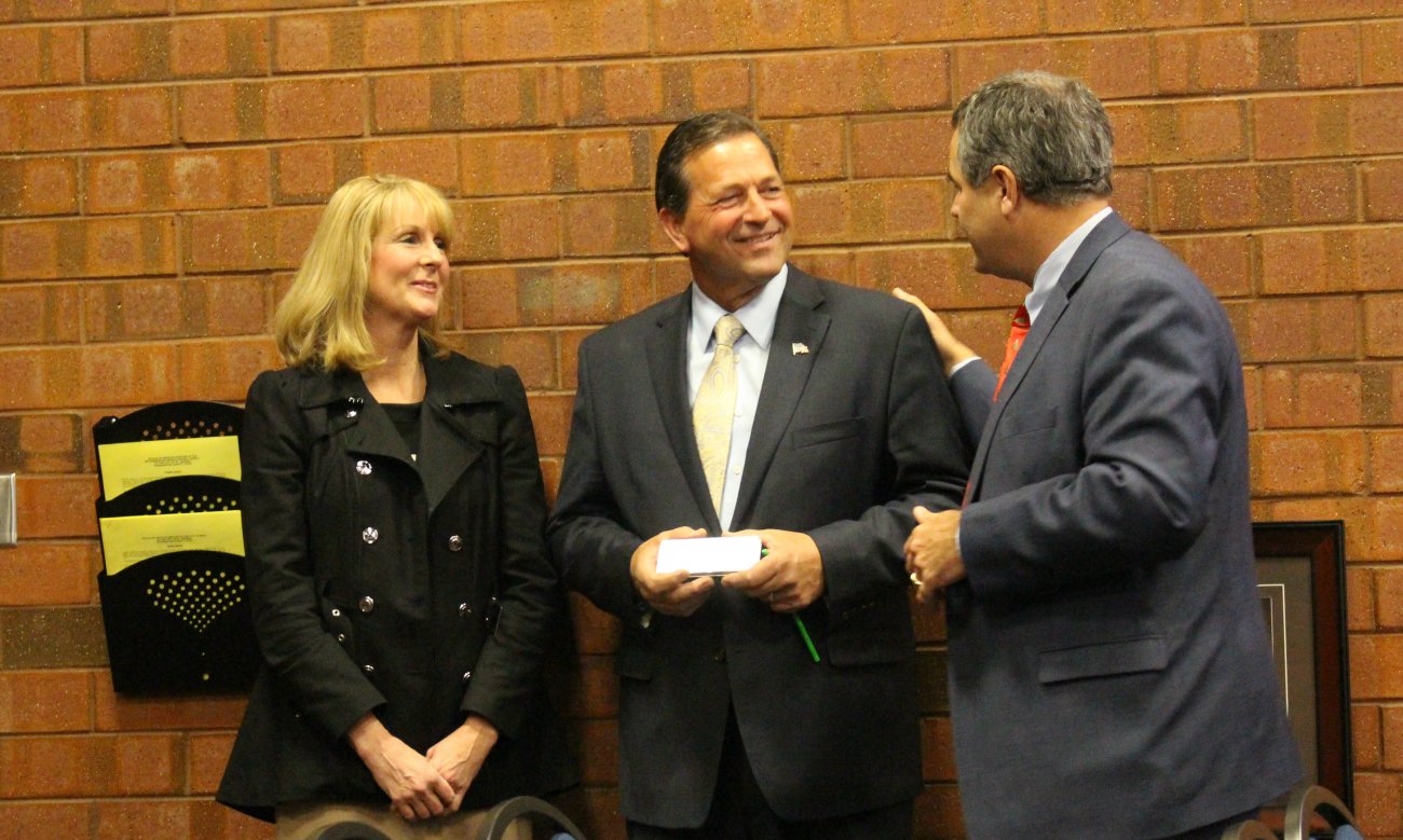 JIll and Gil Almquist with St. George Mayor Jon Pike at the the last St. George City Council meeting of 2015. Prior to the meeting, City Council members and city staff had a going away party for the outgoing Councilman Almquist, St. George, Utah, Dec. 17, 2015 | Photo by Mori Kessler