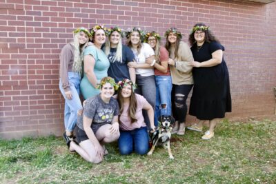 Attendees of a Two Wild Flowers' crown workshop pose together wearing their hand-made crowns, April 11, 2022, St. George, Utah | Photo by Jessi Bang, St. George News