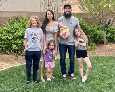 Jesse Trani, owner of "Trani Brothers Landscaping" takes a family photo with his fiance, Vanisa Cleveland, and his four children, April 3, 2022, St. George, Utah | Photo courtesy of Vanisa Cleveland, St. George News