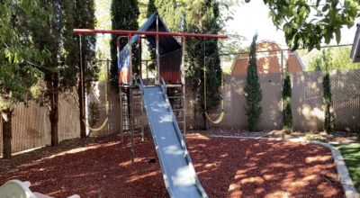 The old jungle gym outside the DOVE Center hows a metal slide, Location and date unspecified | Photo courtesy of Markee Pickett, St. George News