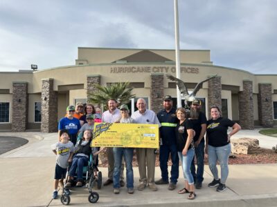 Matt's Off-Road Recovery presents a check for $100,000 at the Hurricane City Council Meeting, Hurricane, Utah, May 5, 2022 | Photo courtesy of Jeffrey Hatcher, St. George News
