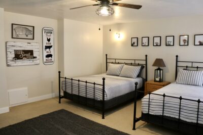 A farm-themed room at Rockmoore Retreats features two beds and farm decor, Hildale, Utah, May 2, 2022 | Photo by Jessi Bang, St. George News