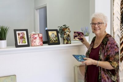 Mel Scott stands with some of her artwork, May 10, 2022, St. George, Utah, May 14, 2022 | Photo by Jessi Bang, St. George News