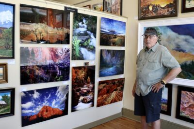 Jack Grosko stands by his photography featured inside the Arrowhead Gallery, St. George, Utah, May 18, 2022 | Photo by Jessi Bang, St. George News