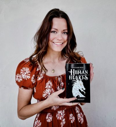 Mary Beesley smiles with her book, location and date unspecified | Photo courtesy of Mary Beesley, St. George News