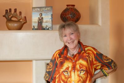 Author Shelly Pollock next to her book, "Lion Lights," St. George, Utah, July 18, 2022 | Photo by Jessi Bang, St. George News