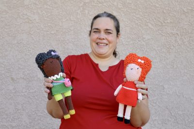 Melissa Daams, owner of Whimsy Winkel, stands with her crochet dolls, St. George, Utah, Aug. 23, 2022 | Photo by Jessi Bang, St. George News