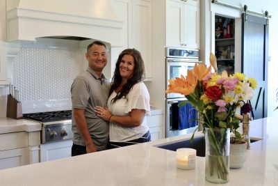 Todd and Stacia Mizukawa pose together in their kitchen, St. George, Utah, Sept. 8, 2022 | Photo by Jessi Bang, St. George News