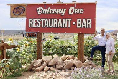 Balcony One owners George and Cindy Rodinos pose in front of their restaurant sign, Virgin, Utah, September 28, 2022 | Photo by Jessi Bang, St. George News