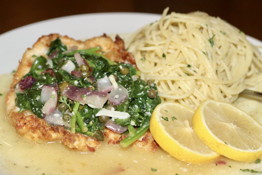 Breaded chicken and pasta dish at Bella Marie's Pizzeria on a dining table in St. George, Utah, December 14, 2022 | Photo by Jessie Bunn, St. George News