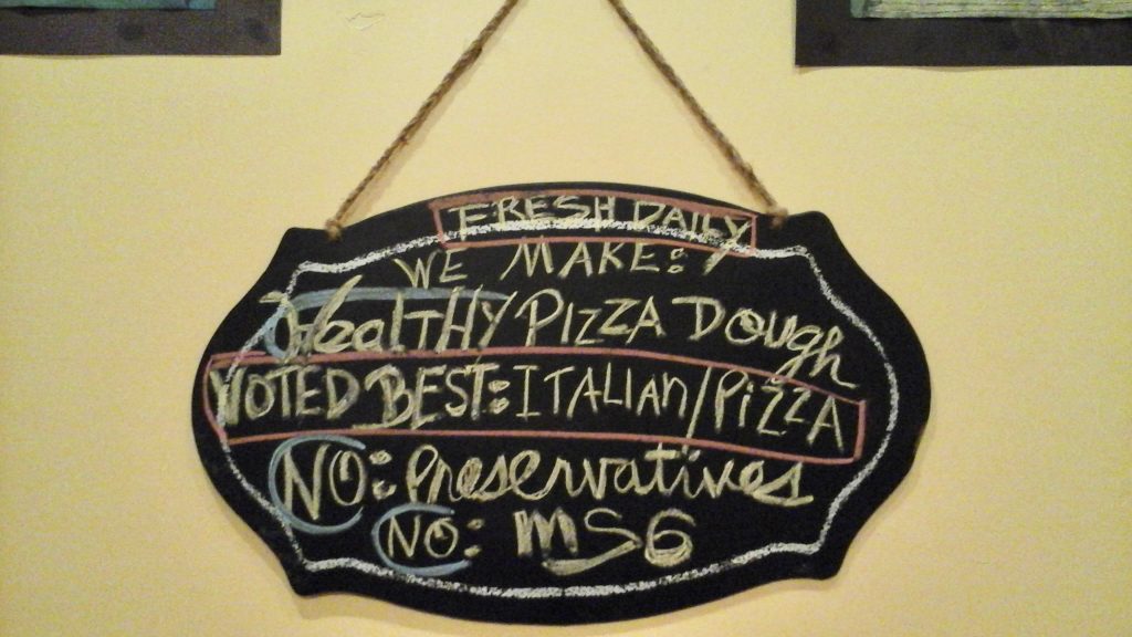 A sign inside Bella Marie's Pizzeria promotes healthy Italian food without preservatives or MSG.St. George, Utah, August 2016 | Photo Credit: Marie Perez, St. George News