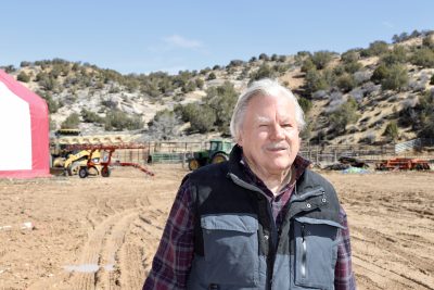 Buck Brand Beef owner Lisle Babcock takes a photo on his property in Kanab, Utah on March 16, 2023 | Photo by Jessi Bang, St. George News