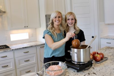 Laura Clark and her daughter Katelyn make caramel apples for their business, St. George, Utah, March 30, 2023 | Photo by Jessi Bang, St. George News