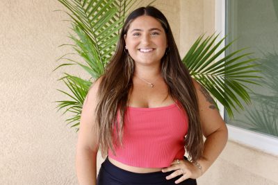 Taylor Meserve, owner of Country Strong Ammo Jewelry smiles for a photo at her home in St. George, Utah, April 12, 2023 | Photo by Jessi Bang, St. George News