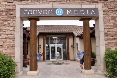 Husband and wife Mikey and Bonnie Foley take a photo together outside their new radio home at Canyon Media in St. George, Utah, May 25, 2023 | Photo by Jessi Bang, St. George News