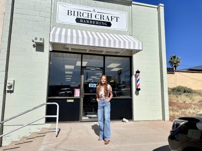 Sarah Birch, Barber and owner of Birch Craft Barbering smiles for a photo outside her shop, St. George, Utah, June 6, 2023 | Photo by Jessi Bang, St. George News