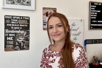 Sarah Birch, Barber and owner of Birch Craft Barbering smiles for a photo inside her shop, St. George, Utah, June 6, 2023 | Photo by Jessi Bang, St. George News