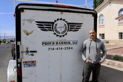 Proud Hammer owner and founder Jose Martinez stands in front of his construction truck outside his home in St. George, Utah, May 31, 2023 | Photo by Jessi Bang, St. George News