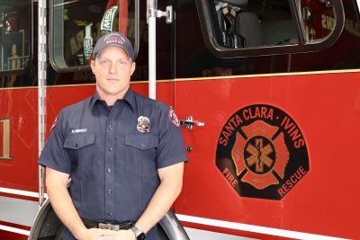 Dustin Benoit stands in front of a fire truck at the Santa Clara - Ivins Fire and Rescue department in Santa Clara, Utah, June 13, 2023 | Photo by Jessi Bang, St. George News