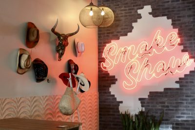 The inside of Pica Rica BBQ features a neon "Smoke Show" sign in St. George, Utah, July 6, 2023 | Photo by Jessi Bang, St. George News