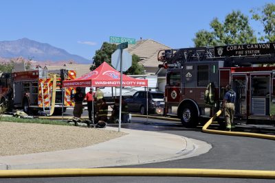 First responders work to secure a home after a fire is reported in the back of a house in Washington City, Utah, Aug. 28, 2023 | Photo by Jessi Bang, St. George News