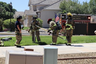 Fire crew work to secure a home after a fire is reported in the back of a house in Washington City, Utah, Aug. 28, 2023 | Photo by Jessi Bang, St. George News
