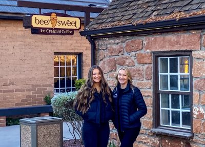 (L-R) Bee Sweet Ice Cream and Coffee owners Kate and Lyndi Rose take a photo outside their shop in St. George, Utah, date unspecified | Photo courtesy of Kate Rose, St. George News