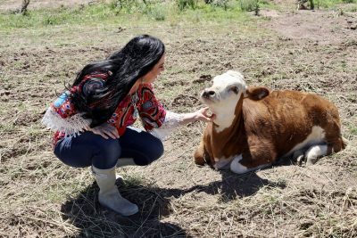 Randilyn Waegerle talks to one of her cows on her farm in Enterprise, Utah, Aug. 30, 2023 | Photo by Jessi Bang, St. George News