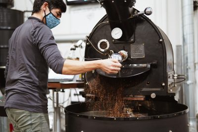 Andrew Coe roasts coffee at his roasting facility in Portland, Oregon, Circa 2022 | Photo courtesy of Andrew Coe, St. George News