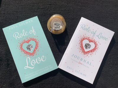 The Roll of Love game, book and journal by Paul Zolman are pictured, location and date unspecified | Photo courtesy of Paul Zolman, St. George News
