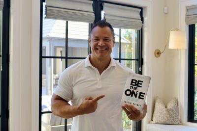 Justin Prince holds his new book "Be the One" inside his home in St. George, Utah, Sept. 26, 2023 | Photo by Jessi Bang, St. George News