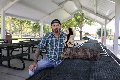 Dustin Mclaughlin, the owner of Humblewood Company, holds one of his wood lamps, St. George, Utah, Oct. 11, 2023 | Photo by Jessi Bang, St. George News