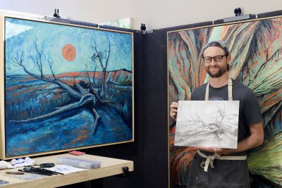 Matt Pectol holds one of his sketches at his studio inside MakeSpace Kayenta, Ivins, Utah, Oct. 25, 2023 | Photo by Jessi Bang, St. George News