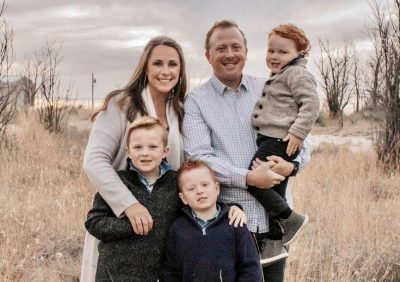 Seven-year-old Neil Hiatt, a recipient of the 2023 Scare Wash proceeds, takes a photo with his family, location and date unspecified | Photo courtesy of Rachelle Peterson, St. George News