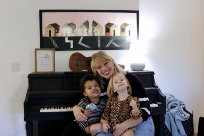 Kimberly Ipson hugs her two children inside her home in St. George, Utah, Dec. 5, 2023 | Photo by Jessi Bang, St. George News