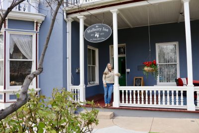 Proud owner Peggy Armour stands outside the Mulberry Inn, St. George, Utah, Jan. 17, 2024 | Photo by Jessi Bang, St. George News