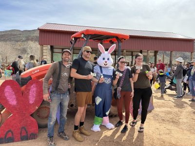 Payton Fisher takes a photo with cash winners from the adult easter egg hunt at Fisher Family Farm in Hurricane, Utah, circa 2023 | Photo courtesy of Payton Fisher, St. George News