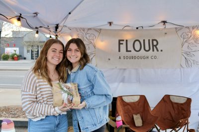 Breann Sornsen and Maya Lawrence sell their homemade sourdough bread at the Wednesday Night Market in St. George, Utah, March 6, 2024 | Photo by Jessi Bang, St. George News