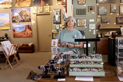 Barbara Parks stands next to her creations inside Gallery 873 in Ivins, Utah, May 29, 2024 | Photo by Jessi Bang, St. George News