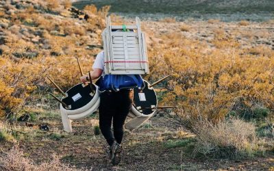 Maria Simpson, owner and founder of Make a Scene, carries furniture and decor to a scenic area where she will create a luxury picnic, location and date not specified | Photo courtesy of Maria Simpson, St. George News