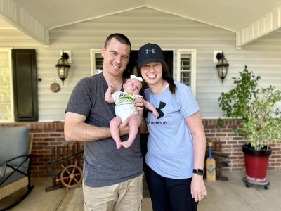 Miles and Madison Thornton smile for a family photo with their baby McKinley Marie Thornton in Washington, Utah, July 31, 2024 | Photo by Jessi Bang, St. George News