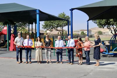 Students, parents and donors celebrate the official opening of Little Valley Elementary's new all-inclusive playground with a ribbon-cutting ceremony, St. George, Utah, Aug. 1, 2024 | Photo by Jessi Bang, St. George News