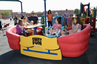Students, parents and donors celebrate the official opening of Little Valley Elementary's new all-inclusive playground with a ribbon-cutting ceremony, St. George, Utah, Aug. 1, 2024 | Photo by Jessi Bang, St. George News